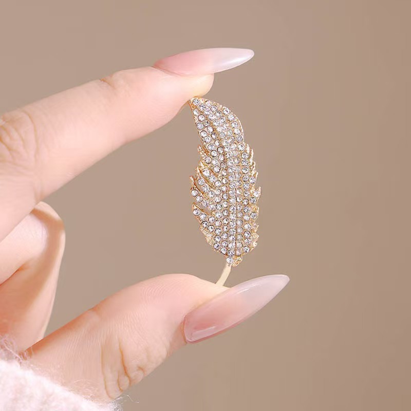 El broche de plumas de diamant - Travel Accessories Luxury reseña y precio