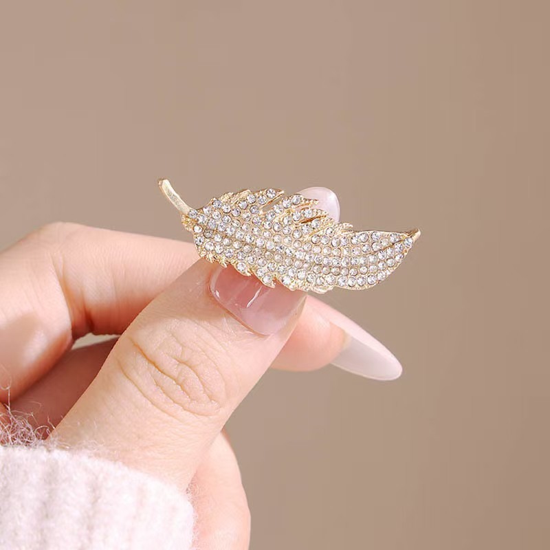 El broche de plumas de diamant - Travel Accessories Luxury reseña y precio